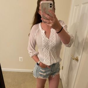 White lace/sheer blouse. Perfect for the beach on a cooler night.